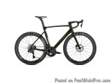 The image is of a green and black road bike. The bike has a sleek design with a black saddle and handlebars. It has a black f...