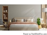 The image shows a modern and minimalistic bedroom with a large bed in the center. The bed has a beige headboard and is covere...