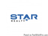 The image is a logo for a real estate company called STAR Realty. The logo is written in a bold, sans-serif font and is in a...