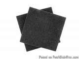 The image shows three black sponges stacked on top of each other. The spongs appear to be made of a soft, sponge-like materia...