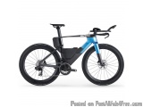 The image is of a blue and black BMX bike. The bike has a sleek design with a black frame and blue accents. It has a black sa...