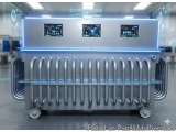 The image shows a large industrial machine with a metallic frame and multiple screens on top. The machine appears to be made...
