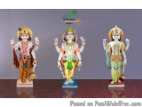 The image shows three Hindu deities, Lord Hanuman, standing side by side on a wooden surface. On the left, Hanuman is wearing...