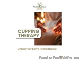 The image shows a close-up of a person's back receiving cupping therapy. The person is lying on their stomach with their hand...