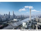 The image is an aerial view of a city with a tall skyscraper in the center. The skyscraper is the tallest building in the wor...