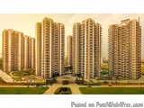 The image shows a group of tall, multi-storey residential buildings with a modern design. The buildings are arranged in a row...