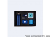 The image shows a black rectangular box with a blue interior. Inside the box, there are various items arranged neatly. On the...