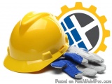 The image shows a yellow hard hat and a pair of blue and white gloves. The hard hat is placed on the left side of the image,...