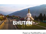 The image is a landscape photograph of Bhutan by Road. It shows a beautiful view of a Buddhist temple in the middle of a vall...