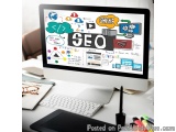 The image shows a desktop computer monitor with the word "SEO" written in bold letters at the top. The monitor is placed on a...