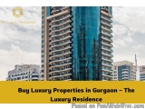 The image shows a tall, modern building with a blue glass facade. The building appears to be a luxury apartment complex in Gu...
