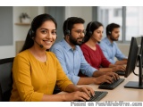 The image shows a group of four people working in a call center. They are all wearing headsets and are sitting at a desk with...