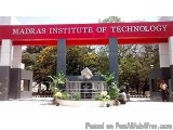 The image shows the entrance of the Madras Institute of Technology. The entrance is marked by a red arch with the words "Madr...