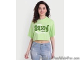 The image shows a young woman with curly hair, wearing a lime green cropped t-shirt with the words "Sassy Classy" written in...