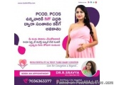 The image is an advertisement for a pregnancy test tube baby center in India. The advertisement features a photo of a pregnan...