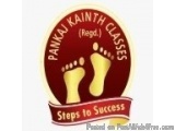 The image is a logo for Pankaj Kainth Classes, a company that provides classes in India. The logo is circular in shape and ha...
