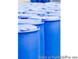 The image shows a group of blue plastic drums stacked on top of each other. The drums are arranged in a neat and orderly mann...
