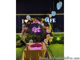 The image shows a beautiful arch made of colorful balloons with the words "I Love Bride" written on it. The arch is set up on...