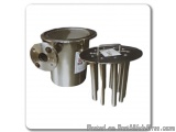 The image shows a stainless steel cylindrical object with a flange on the left side. The object appears to be a pressure reli...