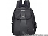 The image is of a black backpack with a sleek and modern design. The backpack has a large main compartment with a zipper clos...