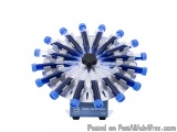The image shows a rotary blood mixer, which is a device used to mix blood samples. It is a circular device with a black base...