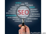 The image shows a hand holding a magnifying glass with the word "SEO" in the center, surrounded by various words related to S...