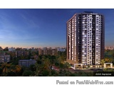 The image is a 3D rendering of a modern apartment building at night. The building is tall and has multiple floors and balconi...