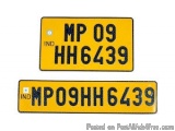 The image shows two rectangular plates with the text "MP 09" and "HH6439" written on them. The plates are yellow in color and...