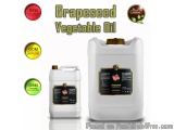 The image shows two white plastic jerry cans of grapeseed vegetable oil. The cans are labeled with the brand name "Grapeseed...