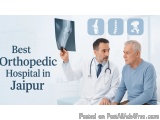 The image shows a doctor and an elderly man sitting in a hospital room. The doctor is wearing a white coat and a stethoscope...