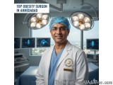 The image shows a man in a medical operating room. He is wearing a white lab coat with a blue surgical cap on his head and a...