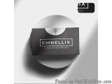 The image is a black and white circular packaging box with the brand name "EMBELLIX" written in white capital letters on the...