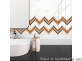 The image shows a modern bathroom with a white sink and a black countertop. The sink has a silver faucet and there are two bo...
