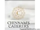 The image is a logo for a company called "Chinnam's Caterers". The logo is a circular design with a white background and a go...