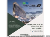 The image is an advertisement for a luxury shopping center called Paragon 57. The background of the image is a photograph of...